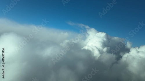 Wallpaper Mural Unique aerial view flying through a stormy sky at the pilot’s eyes from a jet cockpit overflying some cumulonimbus clouds. An immersive pilot’s perspective. 4K 60FPS Torontodigital.ca