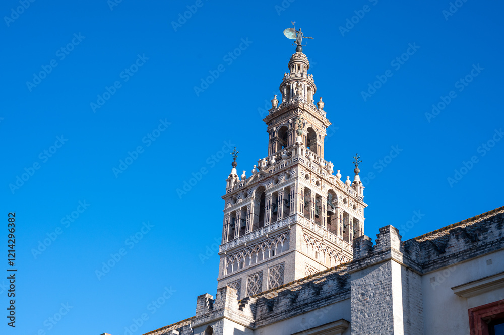 Fototapeta premium Walking in old historical Andalusian town Seville, Cathedral church, Spain. View on houses, streets, architectural details of buidings. Summer in Andalusia.