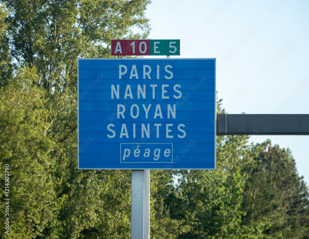 Fototapeta premium Road signs and directions, driving car in summer on French road, tourists destinations French cities and villages, different types or roads in France, transportation and traffic problems