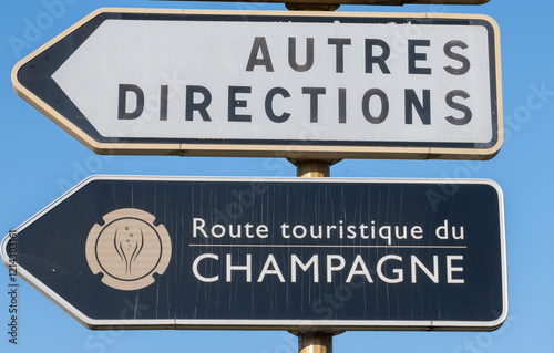 Road signes and places of destinations, Gran Cru villages, black road sign english translation: tourists route. Autumn in Champagne wine making region near Epernay, France. photo