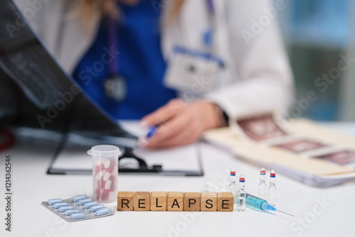 A medical professional examines patient charts, focusing on relapse occurrences and the importance of treatment photo