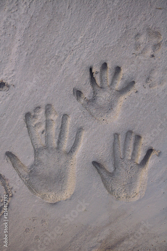 Hand marks on the floor concrete. Hand print in fresh concrete