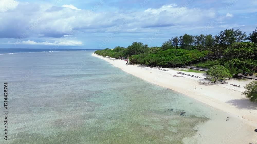 Aerial drone view of Gili Trawangan's stunning beach. Crystal-clear waters on white sand beach on vibrant island scenery, famous travel destination with stunning nature landscape. Aerial drone view of Gili Trawangan's stunning beach. Crystal-clear waters on white sand beach on vibrant island scenery, famous travel destination with stunning nature landscape.