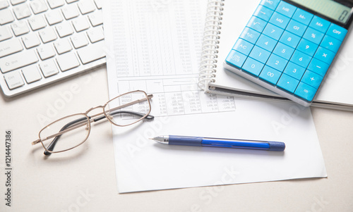 Financial accounting with a calculator and pen. Finance