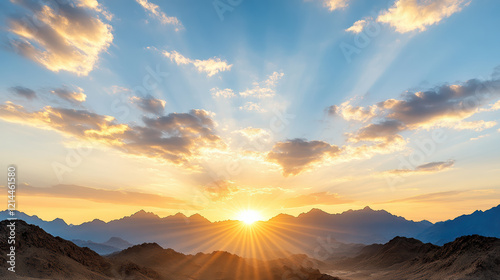 Fototapeta Naklejka Na Ścianę i Meble -  Majestic mountains silhouetted against colorful sunset sky
