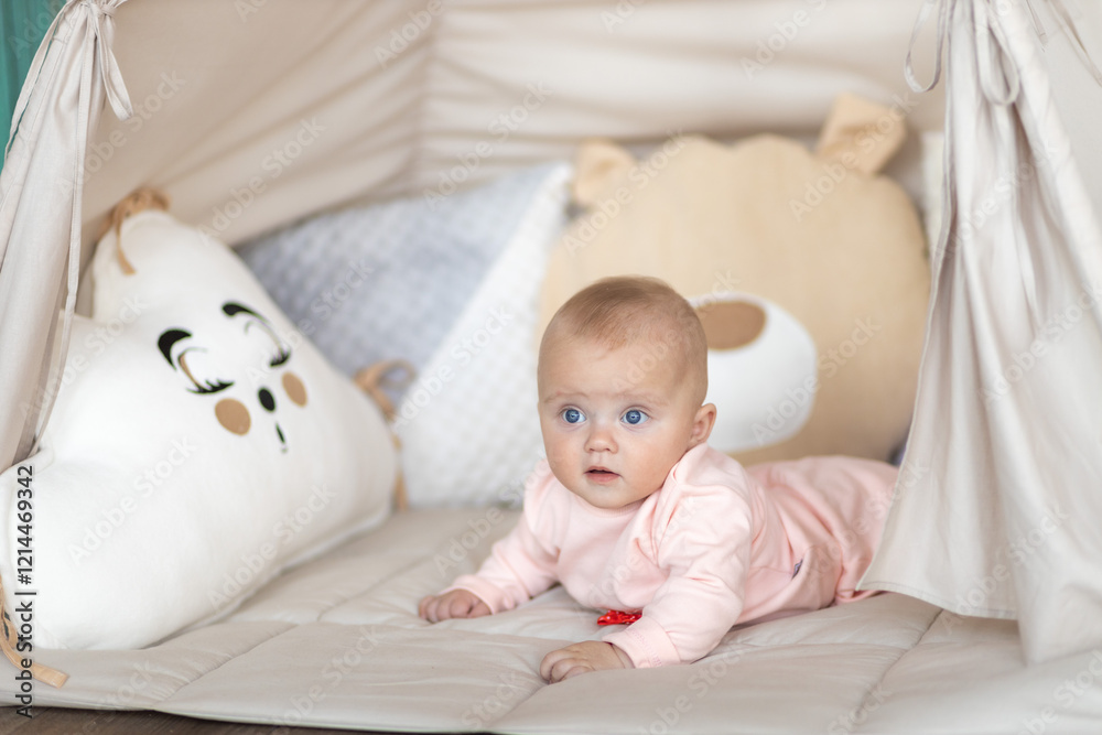 Baby Lying on Soft Mat Looking at Camera in Cozy Room Baby Lying on Soft Mat Looking at Camera in Cozy Room