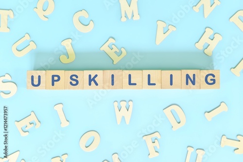 Obraz na płótnie Word upskilling spelled in wooden blocks letters. Upskilling in workplace. w salonie