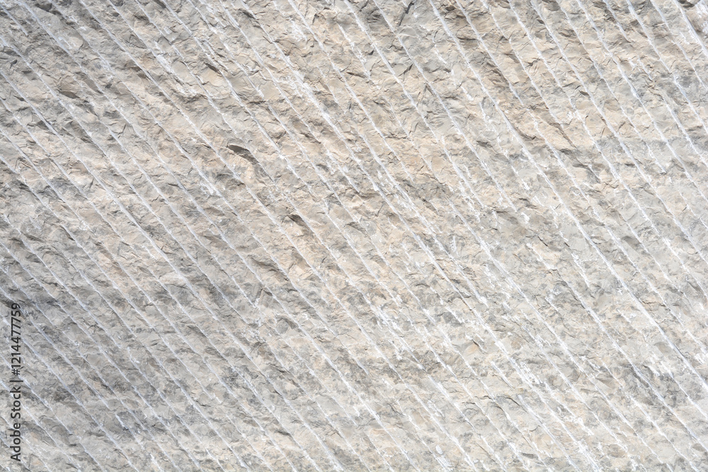 Obraz premium A stone texture with parallel, diagonal cutting lines