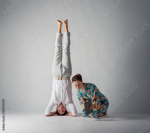 the man stands upside down photo