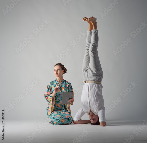 the man stands upside down photo