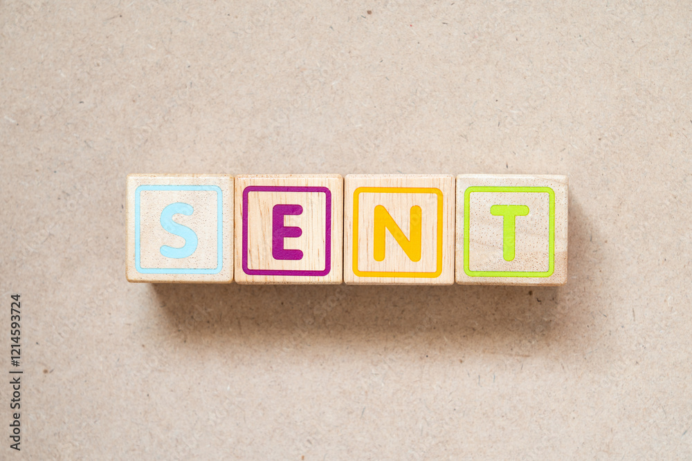 Alphabet letter block in word sent on wood background Alphabet letter block in word sent on wood background