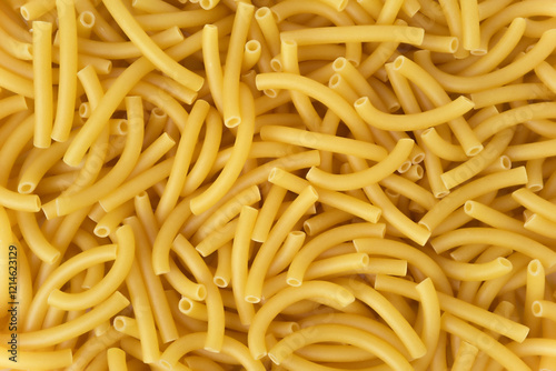 Dry pasta macaroni background. Close up photograph. Top view.  