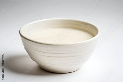 A bowl filled with milk photo