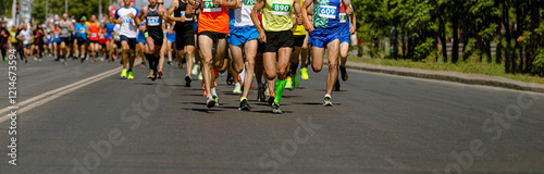 Fotografia athletes race down road in colorful running gear, showcasing determination and s