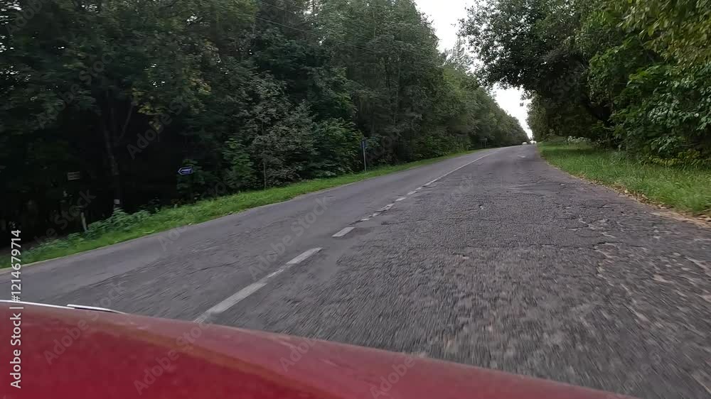 Highways, roadside and road line markings. The car drives along the road on a summer day. Highways, roadside and road line markings. The car drives along the road on a summer day.