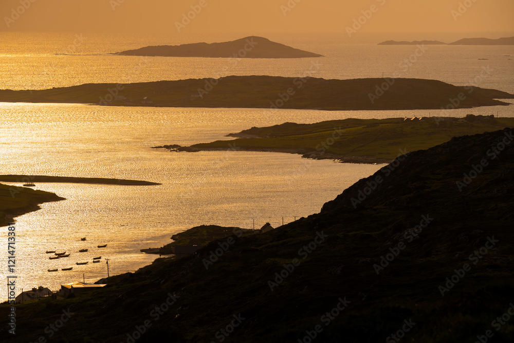 Sunset view of Ardmore and Turbot islands from famous scenic Sky Road, 15km looped drive starting in Clifden with numerous brilliant viewing points, Wild Atlantic Way, Connemara, Ireland. Sunset view of Ardmore and Turbot islands from famous scenic Sky Road, 15km looped drive starting in Clifden with numerous brilliant viewing points, Wild Atlantic Way, Connemara, Ireland.