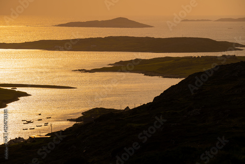 Sunset view of Ardmore and Turbot islands from famous scenic Sky Road, 15km looped drive starting in Clifden with numerous brilliant viewing points, Wild Atlantic Way, Connemara, Ireland. photo