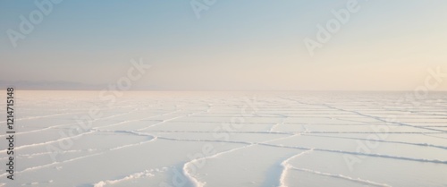 Vast white expanse at salt flats showcases nature's stark beauty and isolation in an endless landscape. photo