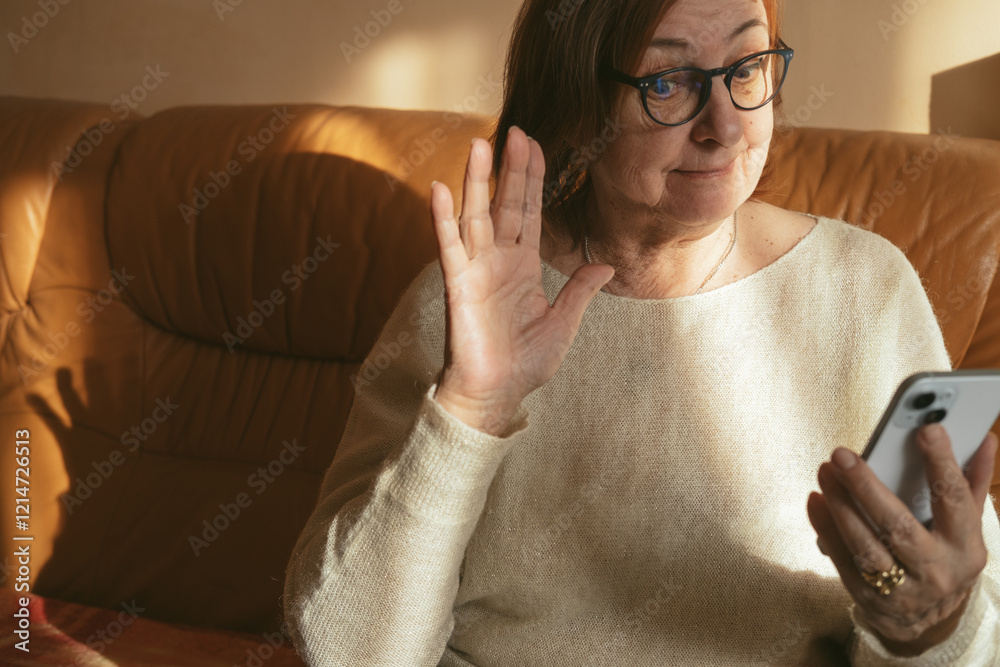 custom made wallpaper toronto digitalHappy elderly senior mature woman is using mobile phone, online video call talk with waving hand, greeting her relatives and grandchildren.