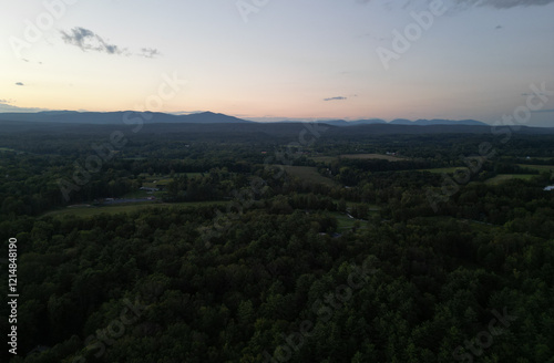 view of catskill mountains at sunset (wide angle aerial mountain vista in catskills hudson valley slide mountain wilderness hiking area) dramatic huge puffy clouds sky cloud formation farm rural area photo