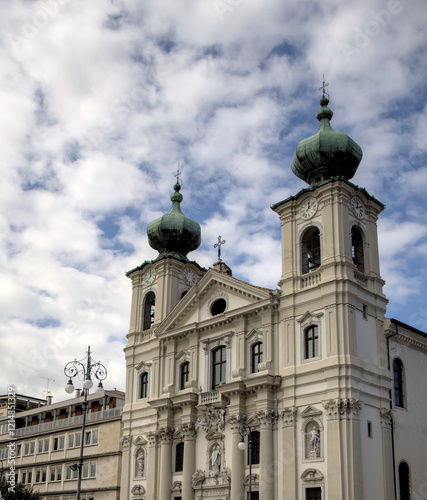 famous old church in gorizia italy (beautiful historic buildings in town square piazza) dome blue sky clouds history italian europe european