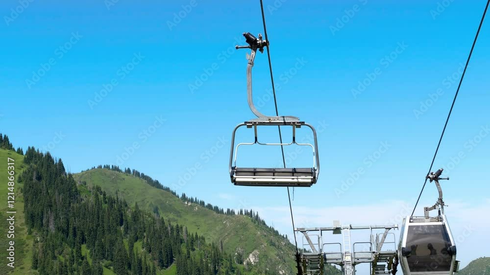 Funicular cabin or Cable car on blue sky clouds background. Sky lift. Cable transportation connects Funicular cabin or Cable car on blue sky clouds background. Sky lift. Cable transportation connects