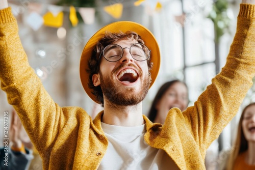 A professional team celebrating a big success in an office, with one individual visibly left out and envious in the corner