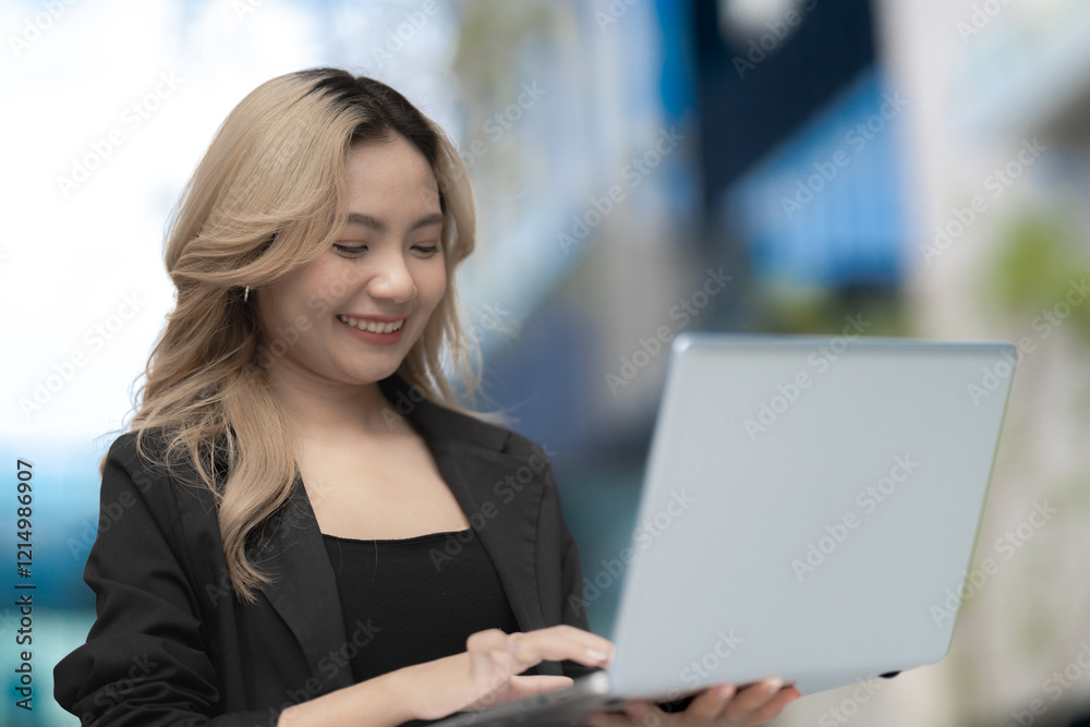 Confident woman with a laptop enjoying her work in an urban backdrop. Captures themes of success, modern technology, and professional enthusiasm. Confident woman with a laptop enjoying her work in an urban backdrop. Captures themes of success, modern technology, and professional enthusiasm.