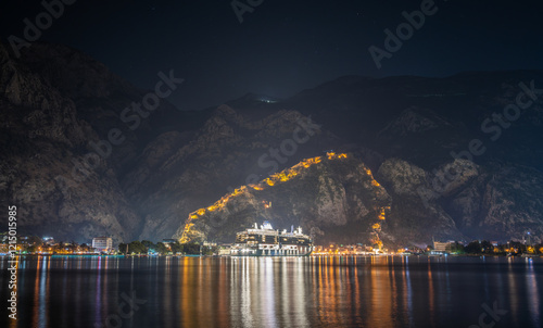 Obraz na płótnie cruise ship on Kotor with fortress and mountains at night in Montenegro w salonie