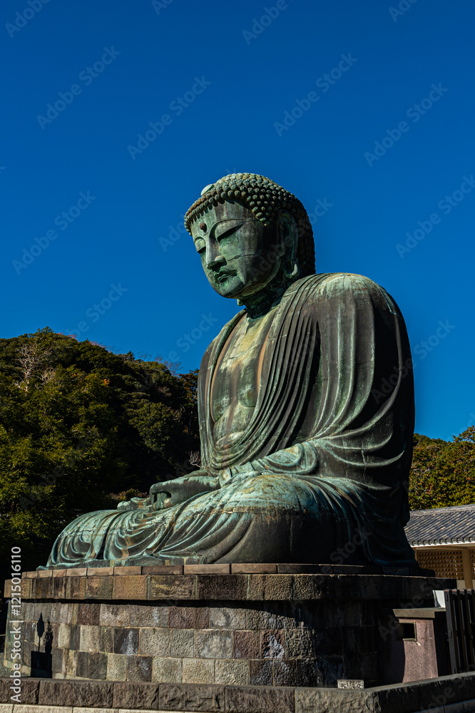 Monumental buddha statue in kamakura japan religious artwork outdoor sunny spiritual reflection Monumental buddha statue in kamakura japan religious artwork outdoor sunny spiritual reflection