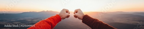 Sunset Adventure Couples Handshake on Mountain Top with Sweaters - Capturing Milestones and Inspiring Travel Narratives for Active Lifestyle Branding photo