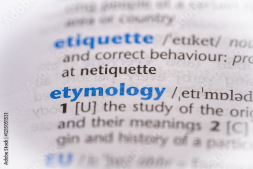 Etymology word in a dictionary. Selective focus, close up.