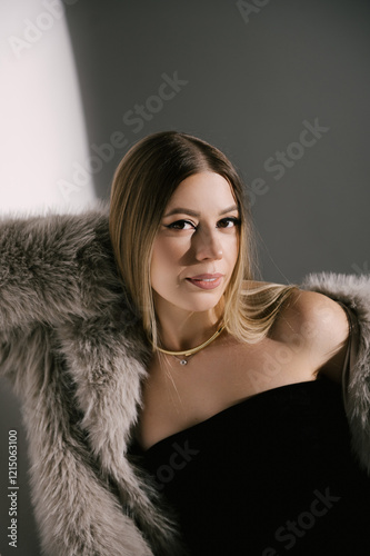 Obraz na płótnie Portrait of a woman in a studio with professional lighting in a smart dress with gloves and a fur coat w salonie
