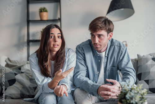 Obraz na plátně Young couple arguing and talking to the camera in videocall conference with specialist about relationship problems difficulties
