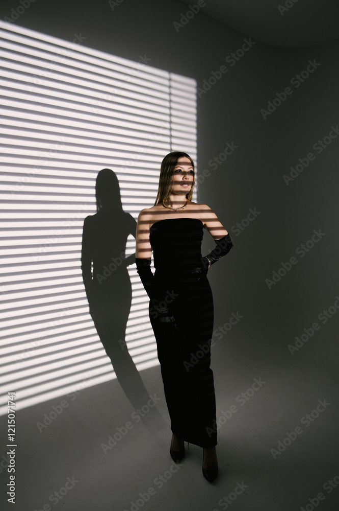 Portrait of a woman in a studio with professional lighting in a smart dress with gloves