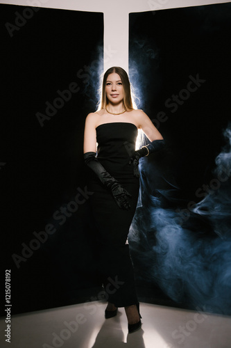 Obraz na płótnie Portrait of a woman in a studio with professional light and smoke in a smart dress with gloves w salonie