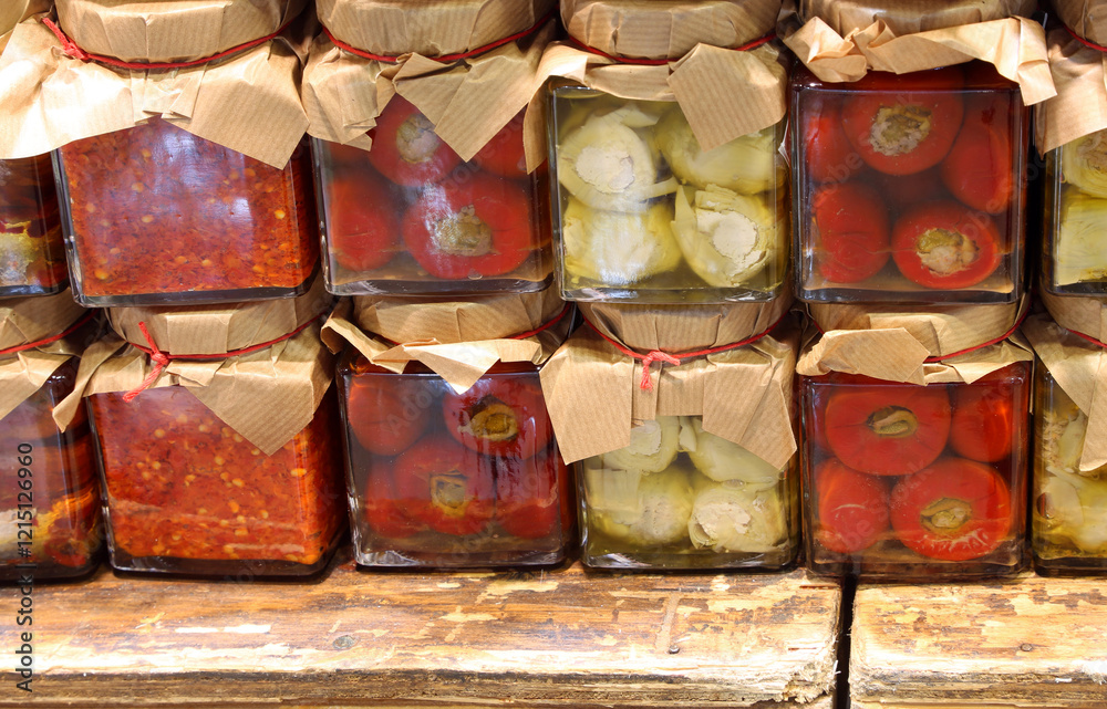 Φωτογραφία peppers and vegetables preserved in glass jars in oil packaged in the southern I