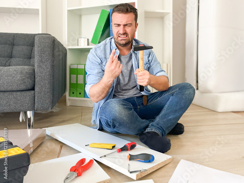 Vászonkép Stressed man trying to assembly new furniture at home using tools