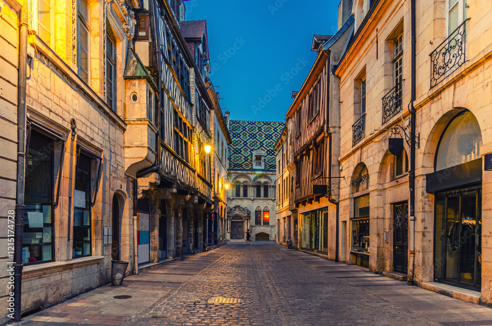 Rue Stephen Liegeard pedestrian street in Dijon city centre with stores, shops and old typical houses medieval buildings, Dijon old town on twilight evening view, Bourgogne-Franche-Comte, France