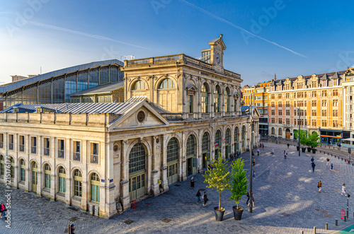Gare de Lille-Flanders railway station in Lille city historical center. Art Deco and Neo-Flemish architecture style building with arched windows and clock tower. French Flanders, Northern France
