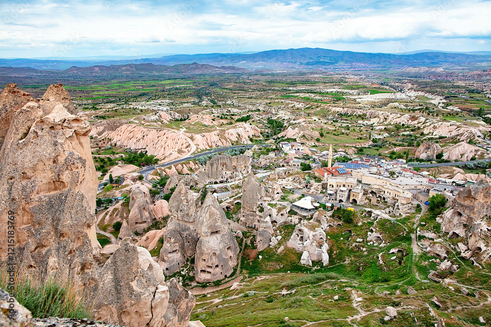 Vast landscapes unfold across Cappadocia with unique rock formations and charming villages