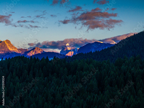 Obraz na płótnie Scenic aerial morning view of misty valleys and forested landscapes in the Dolomites, with Antelao and Cridola peaks in the background. Captured near Danta village, Italy. Hiking in Dolomites. w salonie