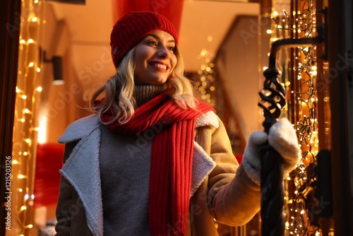 Portrait of happy woman near shop outdoors. Christmas season photo