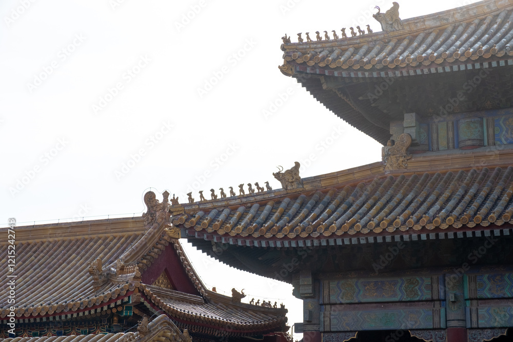 Golden tiled rooftops, Forbidden City architecture, imperial roof figures, traditional Chinese design, Beijing, China, December 17, 2019 Golden tiled rooftops, Forbidden City architecture, imperial roof figures, traditional Chinese design, Beijing, China, December 17, 2019