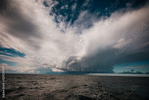 beautiful sky with thickening heavy clouds and a strong thunderstorm before the rain.Bad weather and environment. carbon dioxide emissions, greenhouse effect, global warming, climate change.