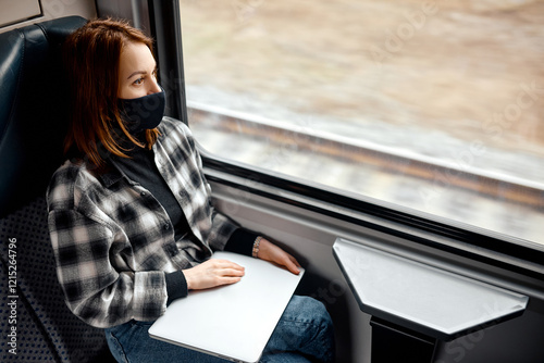 Woman Reflecting on a Train Journey photo