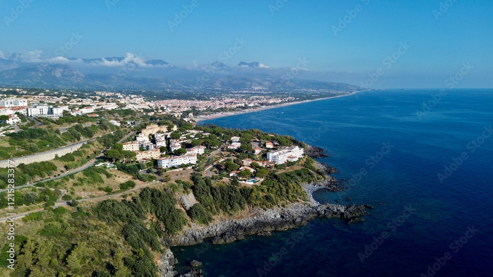 Scenographic aerial view of Calabria Cost with hypnotic blue color sea in summer time Scenographic aerial view of Calabria Cost with hypnotic blue color sea in summer time