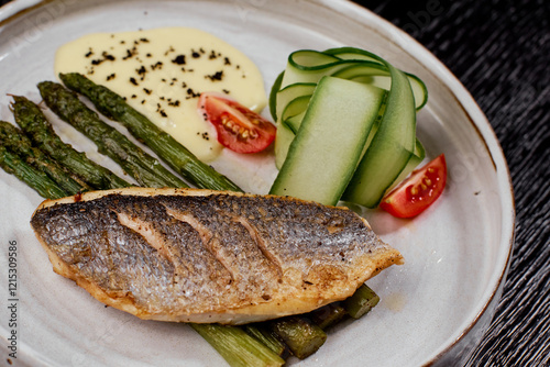 Close-Up of Grilled Sea Bass with Asparagus. photo