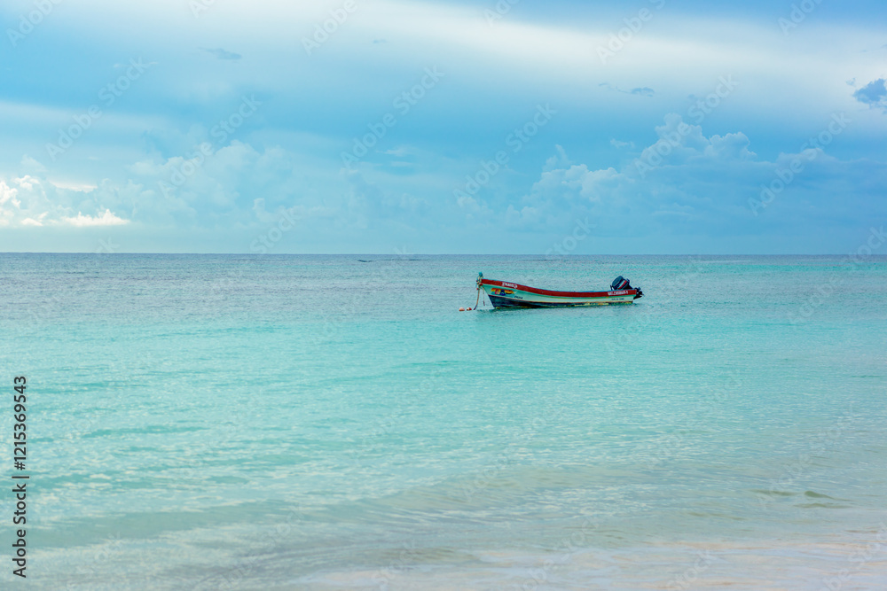 The boat in the Caribbean Sea on a sunny day.