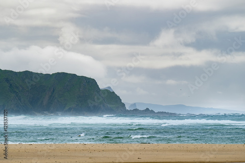 Five Finger Strand, one of the most famous beaches in Inishowen known for its pristine sand and rocky coastline with some of the highest sand dunes in Europe, county Donegal, Ireland. photo